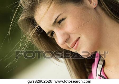 Stock Photograph - Close-up of a teenage girl thinking. Fotosearch