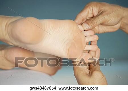 Close-up of a woman getting a foot massage View Large Photo Image Picture - Close-up of a woman getting a foot massage. Fotosearch
