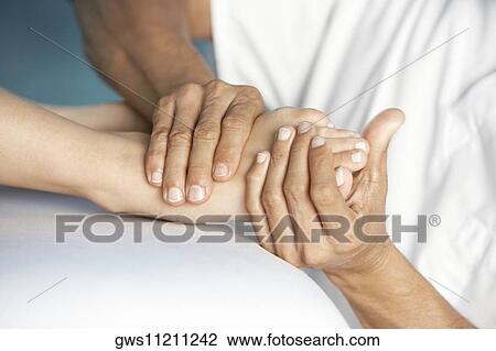 Close-up of a woman getting a foot massage View Large Photo Image Stock Image - Close-up of a woman getting a foot massage. Fotosearch