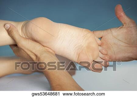 Close-up of a woman getting a foot massage View Large Photo Image Stock Image - Close-up of a woman getting a foot massage. Fotosearch
