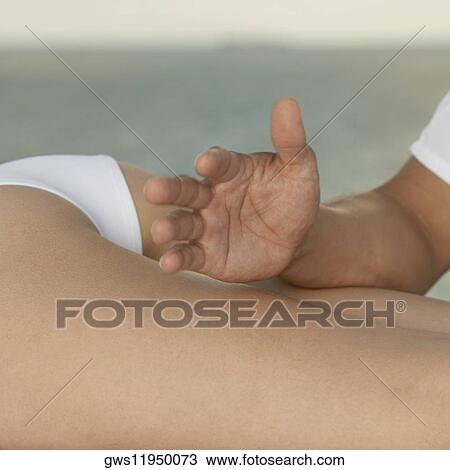 Stock Image - Close-up of a woman getting a massage. Fotosearch