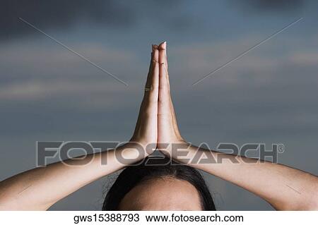 Close-up of a woman in a prayer position View Large Photo Image Stock Image - Close-up of a woman in a prayer position. Fotosearch