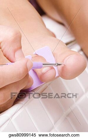 Close-up of a woman's hand using a nail file View Large Photo Image Stock Photography - Close-up of a woman's hand using a nail file. Fotosearch