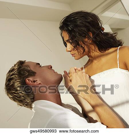 Close-up of a young couple facing each other View Large Photo Image Stock Image - Close-up of a young couple facing each other. Fotosearch