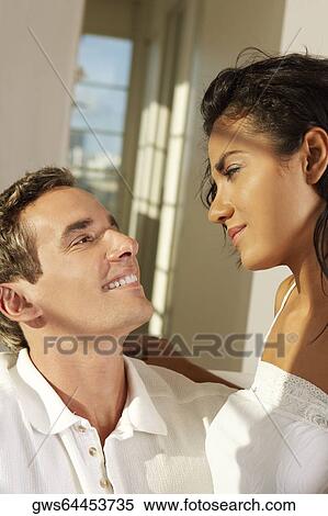Close-up of a young couple facing each other View Large Photo Image Stock Photography - Close-up of a young couple facing each other. Fotosearch