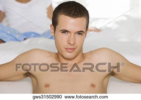 Close-up of a young man smiling View Large Photo Image Stock Image - Close-up of a young man smiling. Fotosearch