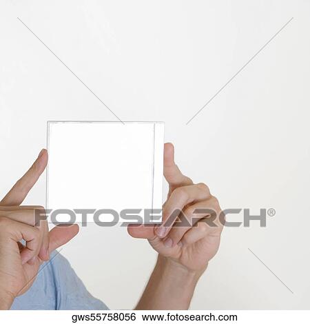 Close-up of a young man's hand holding a CD Case View Large Photo Image Stock Photograph - Close-up of a young man's hand holding a CD Case. Fotosearch