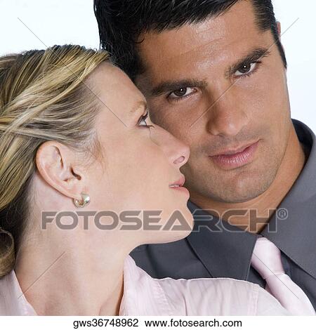 Close-up of a young woman and a mid adult man View Large Photo Image Stock Image - Close-up of a young woman and a mid adult man. Fotosearch