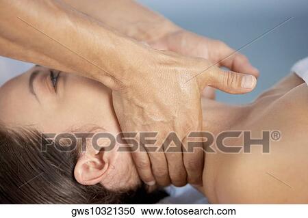 Close-up of a young woman getting a neck massage View Large Photo Image Stock Image - Close-up of a young woman getting a neck massage. Fotosearch