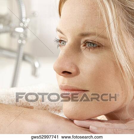 Close-up of a young woman in a bathtub View Large Photo Image Stock Image - Close-up of a young woman in a bathtub. Fotosearch