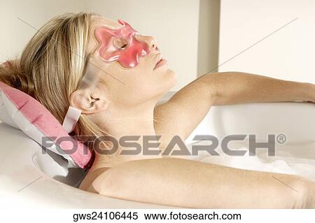 Close-up of a young woman in a bathtub with her eyes closed View Large Photo Image Stock Photography - Close-up of a young woman in a bathtub with her eyes closed. Fotosearch