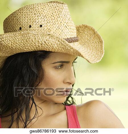 Stock Image - Close-up of a young woman looking serious. Fotosearch
