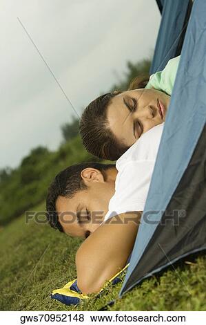 Close-up of a young woman sleeping on the back of a young man View Large Photo Image Stock Photo - Close-up of a young woman sleeping on the back of a young man. Fotosearch