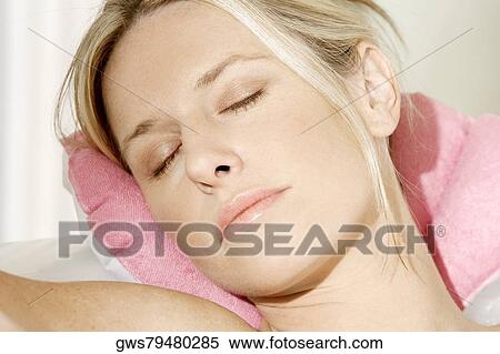 Close-up of a young woman sleeping View Large Photo Image Stock Photography - Close-up of a young woman sleeping. Fotosearch