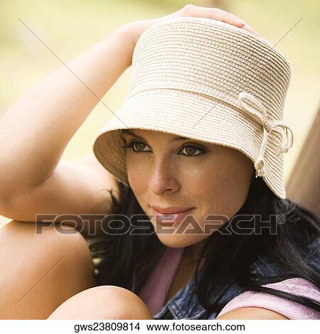 Close-up of a young woman smiling View Large Photo Image Picture - Close-up of a young woman smiling. Fotosearch