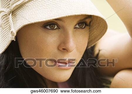 Stock Image - Close-up of a young woman smiling. Fotosearch