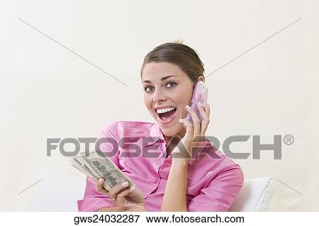 Close-up of a young woman smiling View Large Photo Image Stock Photo - Close-up of a young woman smiling. Fotosearch