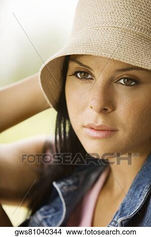 Picture - Close-up of a young woman thinking. Fotosearch
