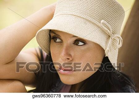 Stock Photo - Close-up of a young woman thinking. Fotosearch