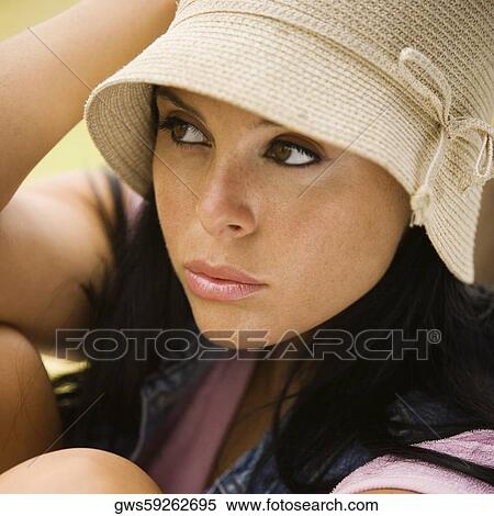 Close-up of a young woman thinking View Large Photo Image Stock Photography - Close-up of a young woman thinking. Fotosearch