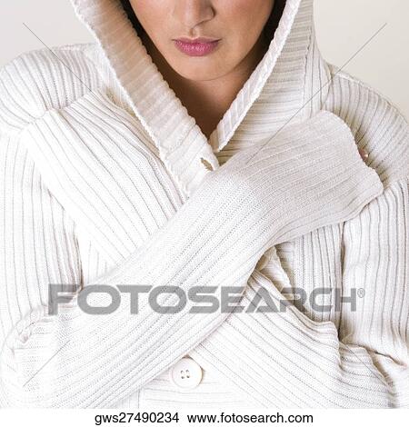 Close-up of a young woman wearing a hooded shirt View Large Photo Image Picture - Close-up of a young woman wearing a hooded shirt. Fotosearch