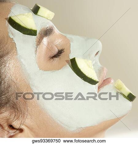 Close-up of a young woman wearing a facial mask View Large Photo Image Stock Image - Close-up of a young woman wearing a facial mask. Fotosearch