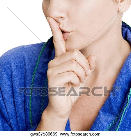 Close-up of a young woman with her finger on her lips View Large Photo Image Stock Photo - Close-up of a young woman with her finger on her lips. Fotosearch