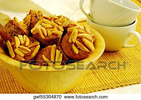 Close-up of almond muffins in a bowl View Large Photo Image Stock Image - Close-up of almond muffins in a bowl. Fotosearch