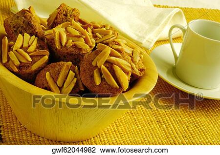Close-up of almond muffins in a bowl View Large Photo Image Stock Image - Close-up of almond muffins in a bowl. Fotosearch