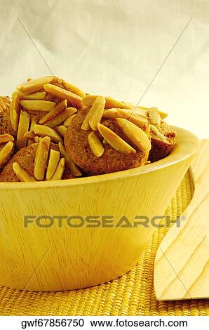 Close-up of almond muffins in a bowl View Large Photo Image Stock Image - Close-up of almond muffins in a bowl. Fotosearch