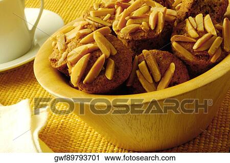 Close-up of almond muffins in a bowl View Large Photo Image Stock Image - Close-up of almond muffins in a bowl. Fotosearch