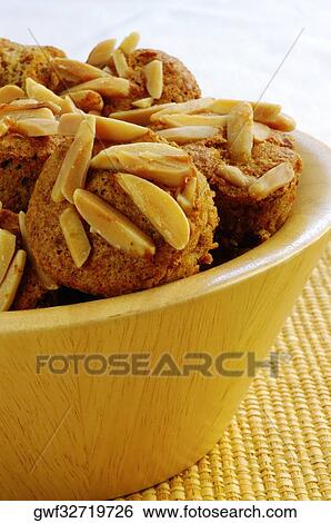 Close-up of almond muffins in a bowl View Large Photo Image Stock Photograph - Close-up of almond muffins in a bowl. Fotosearch