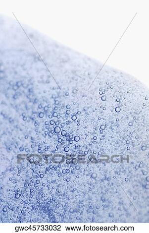 Stock Image - Close-up of bubbles in water. Fotosearch