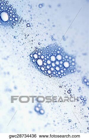 Close-up of bubbles in water View Large Photo Image Stock Photograph - Close-up of bubbles in water. Fotosearch