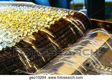 Close-up of fiberglass on a conveyor belt in a factory View Large Photo Image Picture - Close-up of fiberglass on a conveyor belt in a factory. Fotosearch