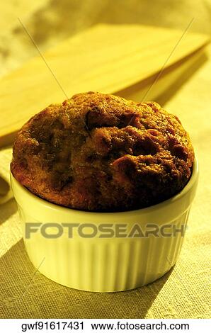 Stock Image - Close-up of muffin in a bowl. Fotosearch