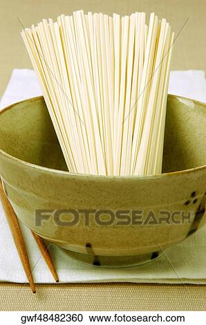 Close-up of raw spaghetti in a bowl View Large Photo Image Stock Image - Close-up of raw spaghetti in a bowl. Fotosearch