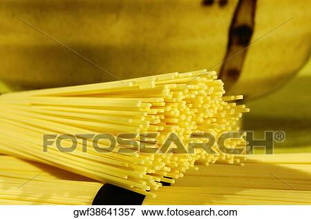 Close-up of raw spaghetti View Large Photo Image Stock Photo - Close-up of raw spaghetti. Fotosearch