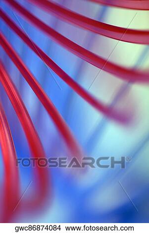 Picture - Close-up of red fiber optic cables. Fotosearch