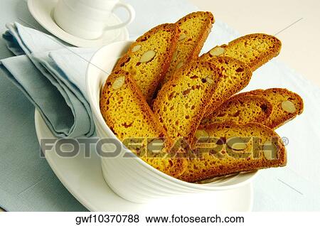 Close-up of slices of almond cake in a bowl View Large Photo Image Stock Photo - Close-up of slices of almond cake in a bowl. Fotosearch