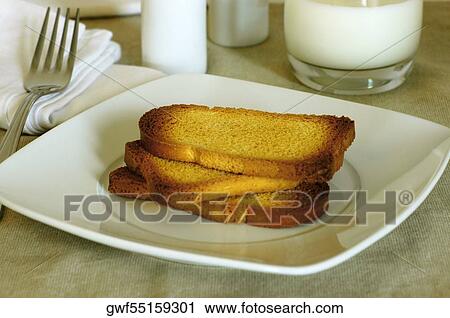 Stock Image - Close-up of slices of toast in a plate. Fotosearch