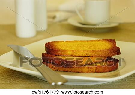 Close-up of slices of toast in a plate View Large Photo Image Stock Photo - Close-up of slices of toast in a plate. Fotosearch