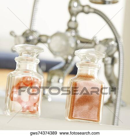 Close-up of soap powder and bath pearls in glass bottles View Large Photo Image Stock Photo - Close-up of soap powder and bath pearls in glass bottles. Fotosearch