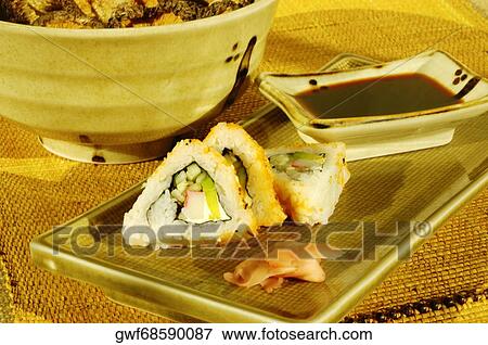 Close-up of sushi with soy sauce on a serving tray View Large Photo Image Stock Photo - Close-up of sushi with soy sauce on a serving tray. Fotosearch