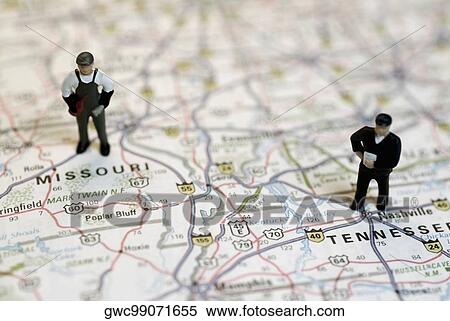 Close-up of the figurines of two construction workers on a map View Large Photo Image Stock Photography - Close-up of the figurines of two construction workers on a map. Fotosearch