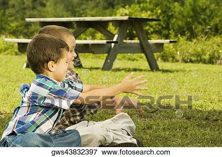 Close-up of two boys catching bubbles View Large Photo Image Stock Photo - Close-up of two boys catching bubbles. Fotosearch