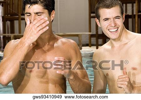 Close-up of two young men in a swimming pool View Large Photo Image Stock Photo - Close-up of two young men in a swimming pool. Fotosearch
