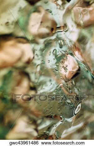 Close-up of water drops on ice cubes View Large Photo Image Stock Photograph - Close-up of water drops on ice cubes. Fotosearch