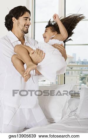 Father playing with his daughter View Large Photo Image Stock Photo - Father playing with his daughter. Fotosearch
