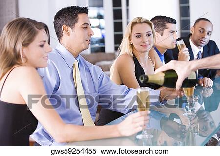 Five people sitting at a bar counter View Large Photo Image Stock Photography - Five people sitting at a bar counter. Fotosearch